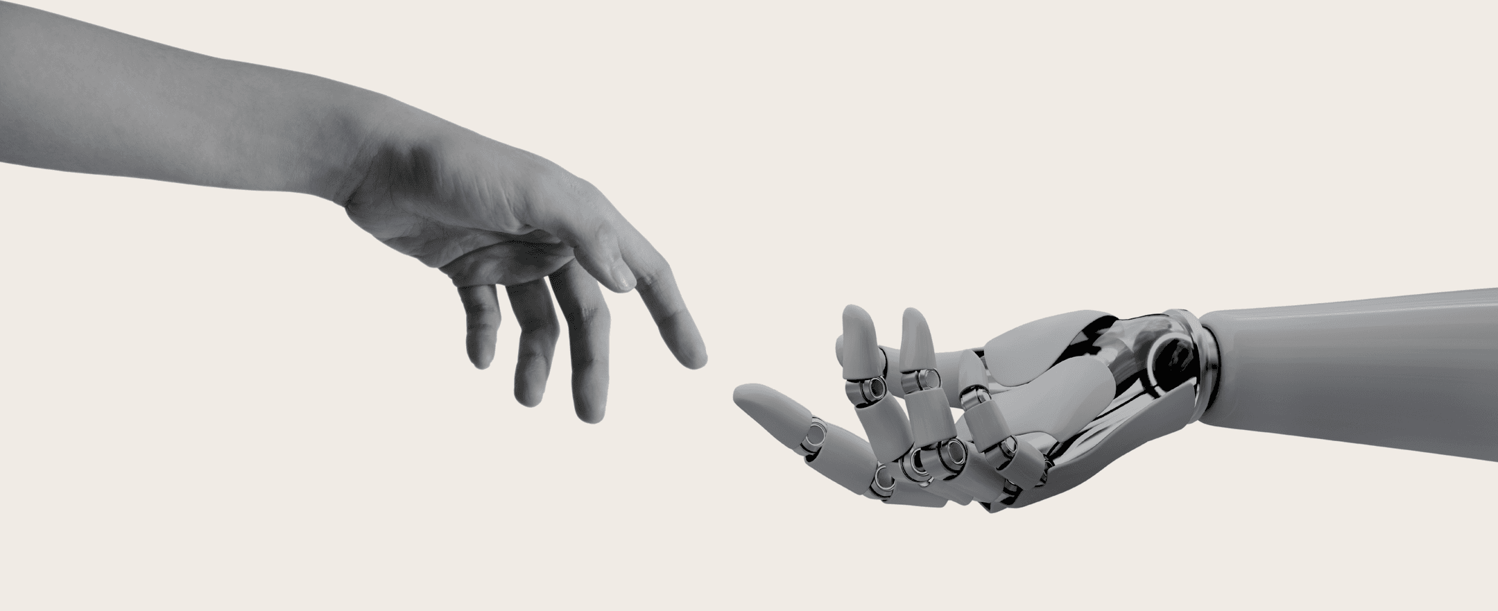 A human hand and a robotic hand reaching toward each other
